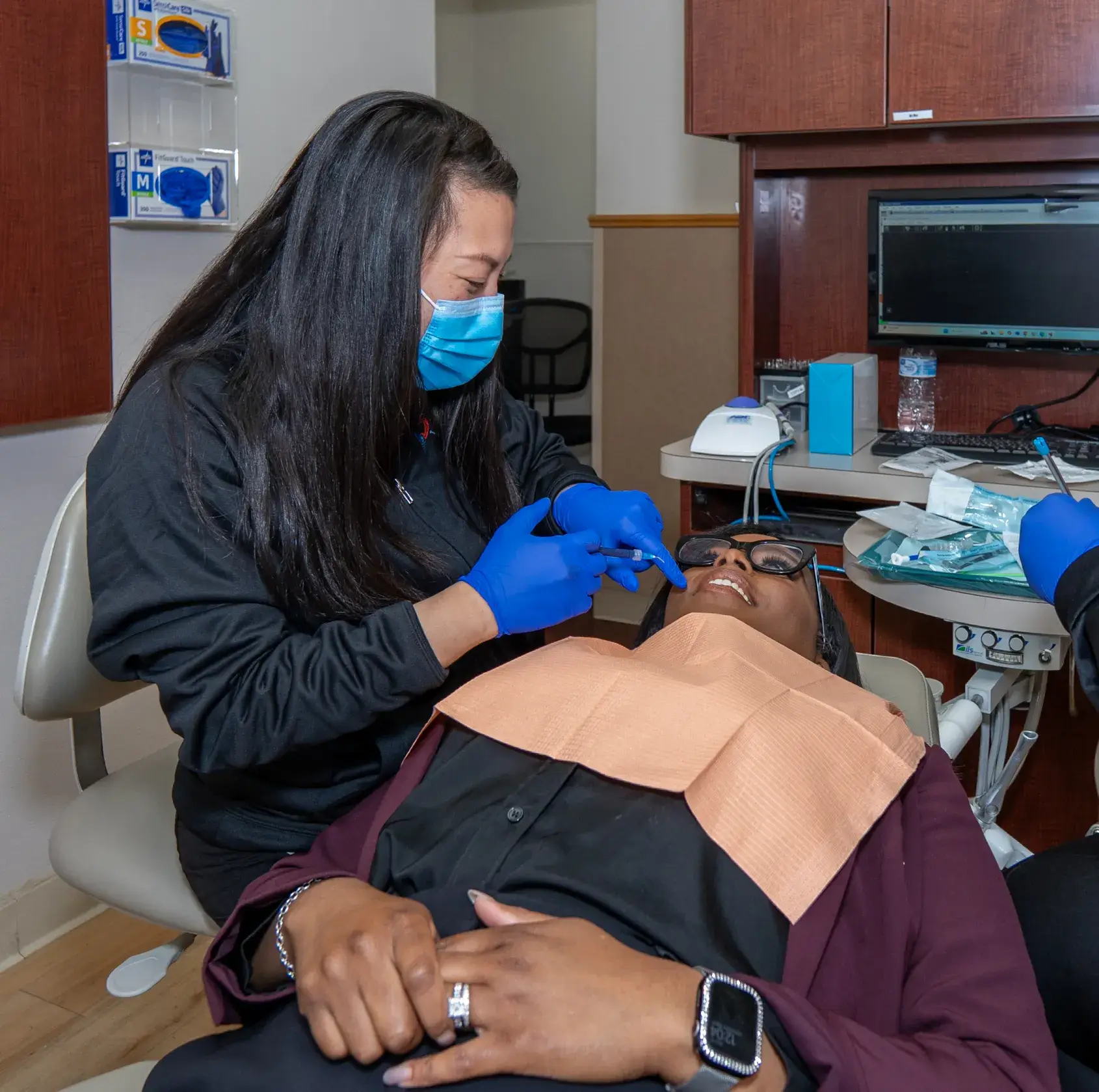Dr. Phung checking patient