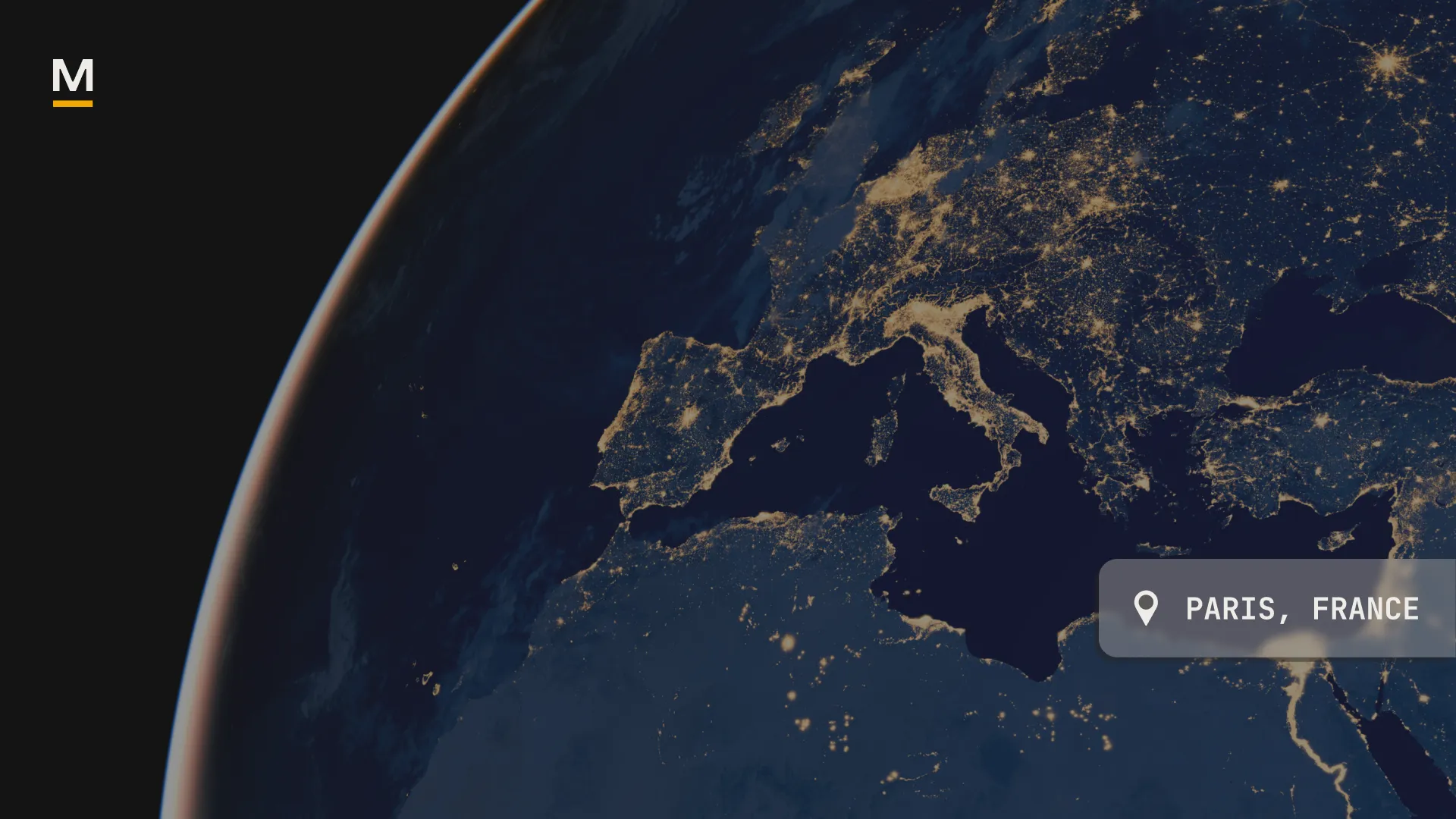 Nighttime satellite view of Europe and northern Africa with city lights highlighting urban areas.