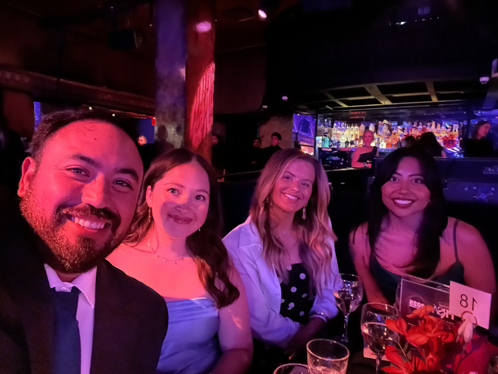 Padilla employees Yoni, Marianna, Ally, and Rosa at a table at the Big Apple 2025 Award show.