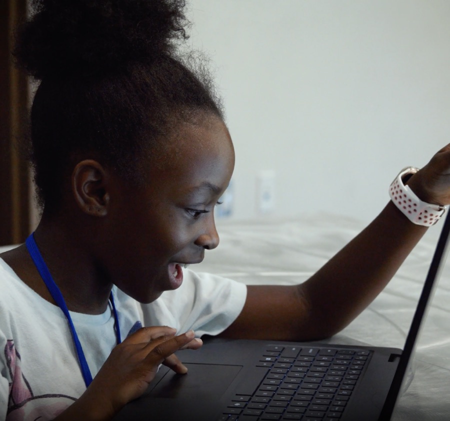 A Novatio student learning on a laptop