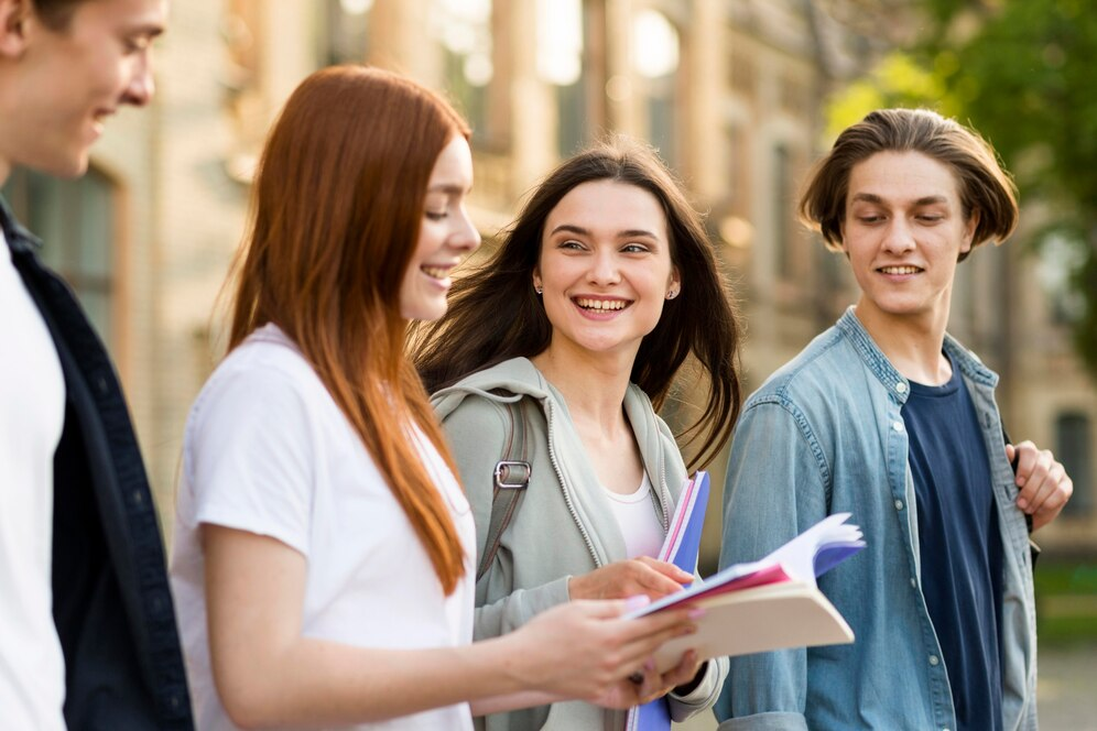 teens with college applications at a campus