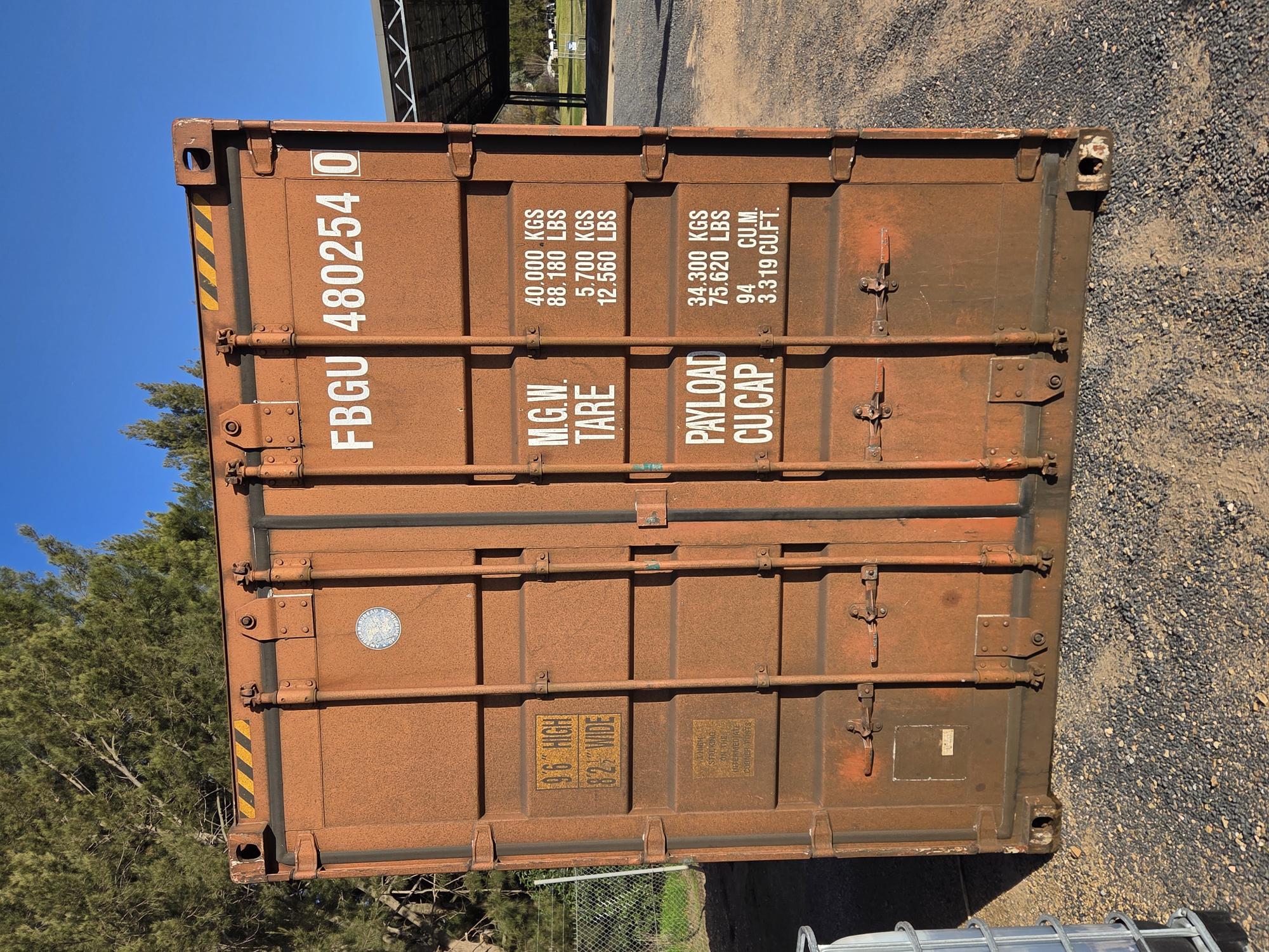 New light yellow shipping containers stacked onto of each other