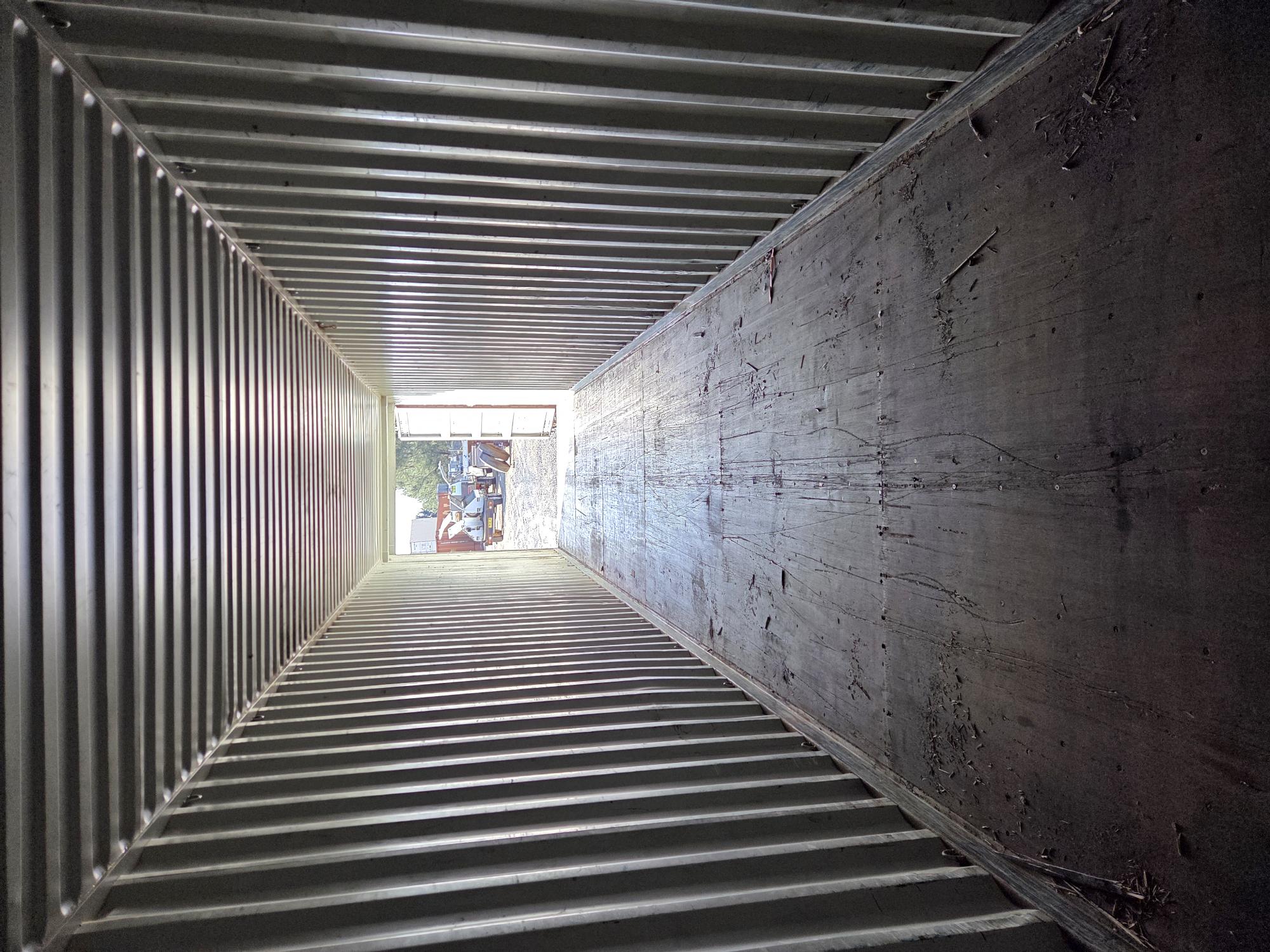 New light yellow shipping containers stacked onto of each other