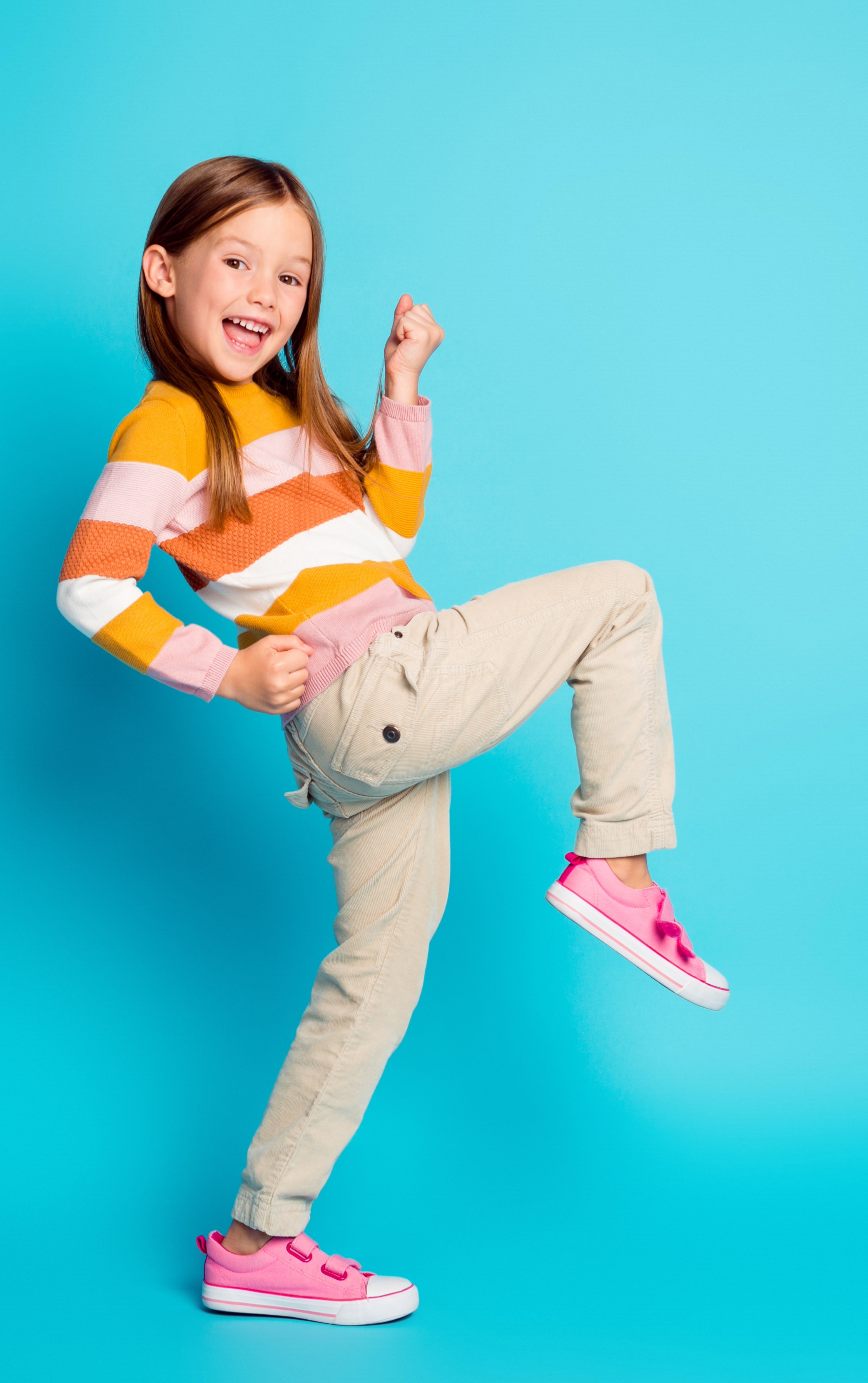 Happy girl going an air kick