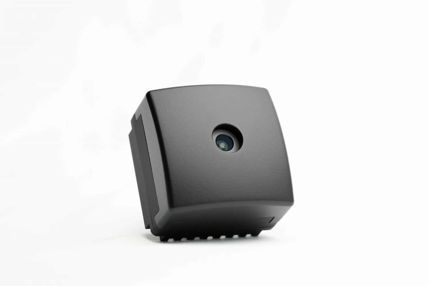 Black compact camera in a black body, seen from a different point of view. 