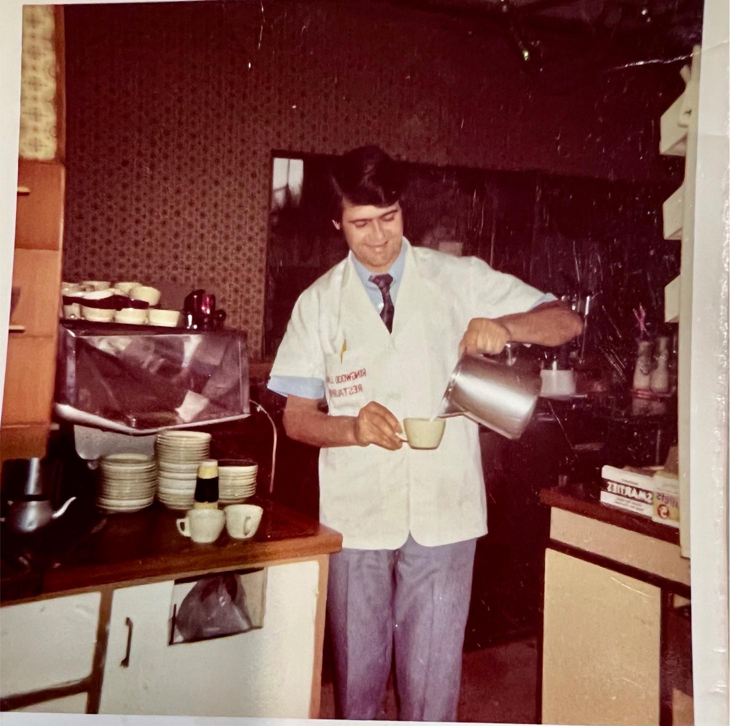 1970s photo of Opack founder working in a cafe