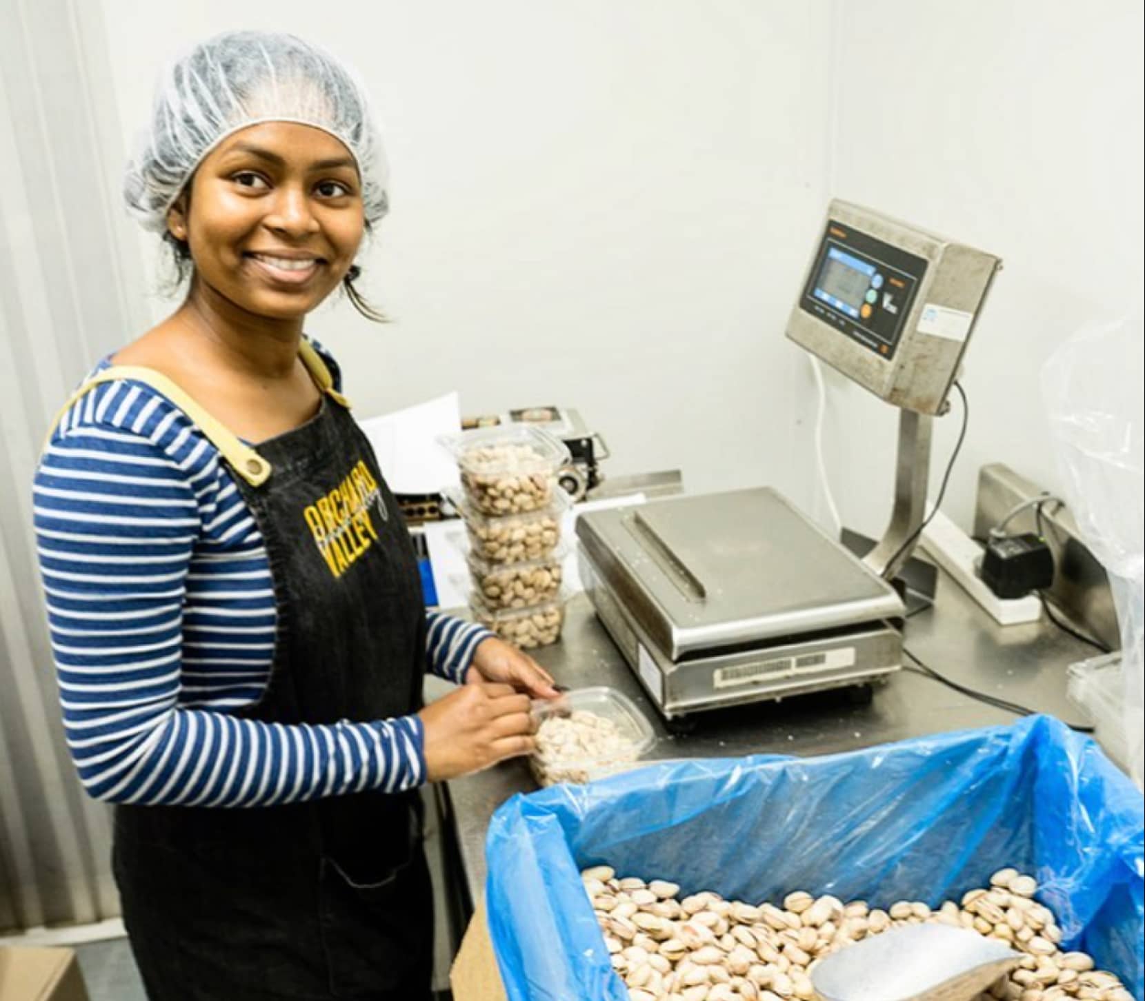 Orchard Valley Nuts Stuff weighing and packing fresh produce