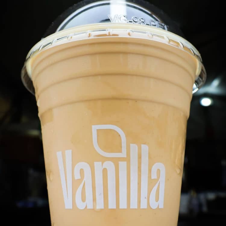 Crisp, cold drink cup branded with the Vanilla logo