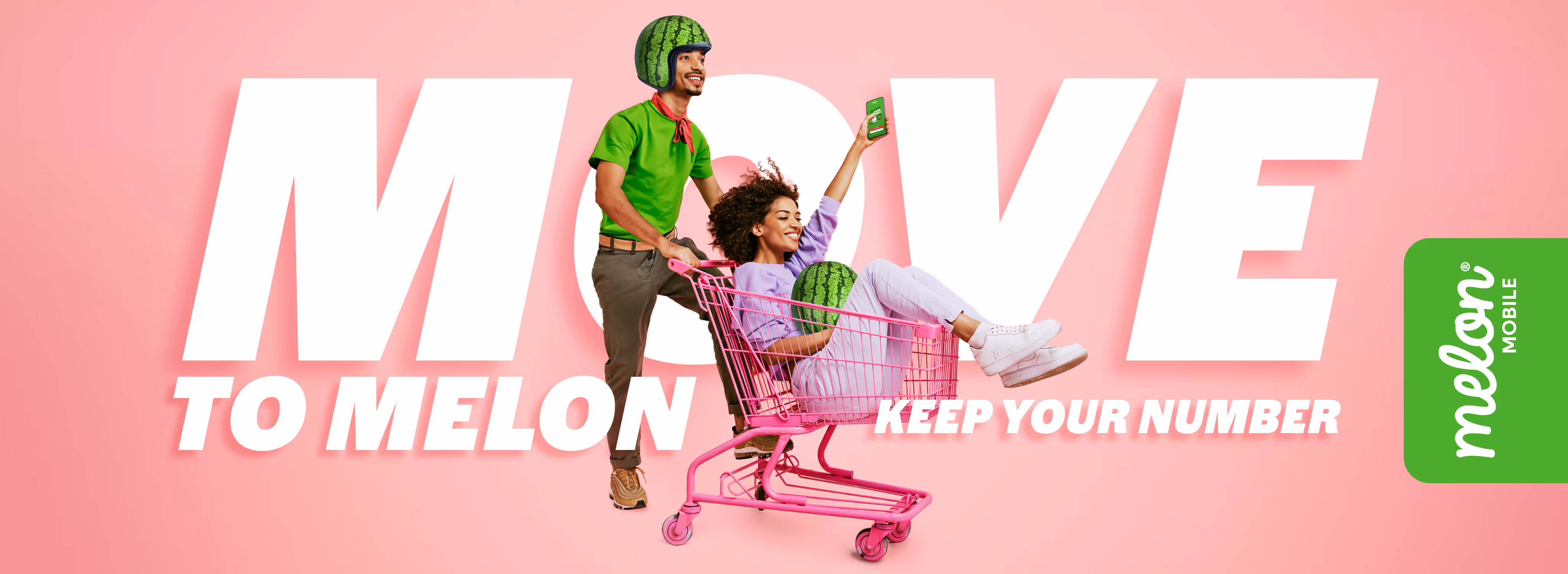 Man wearing water melon helmet pushing a girl in a trolley holding a water melon and a phone with the Melon Mobile app open