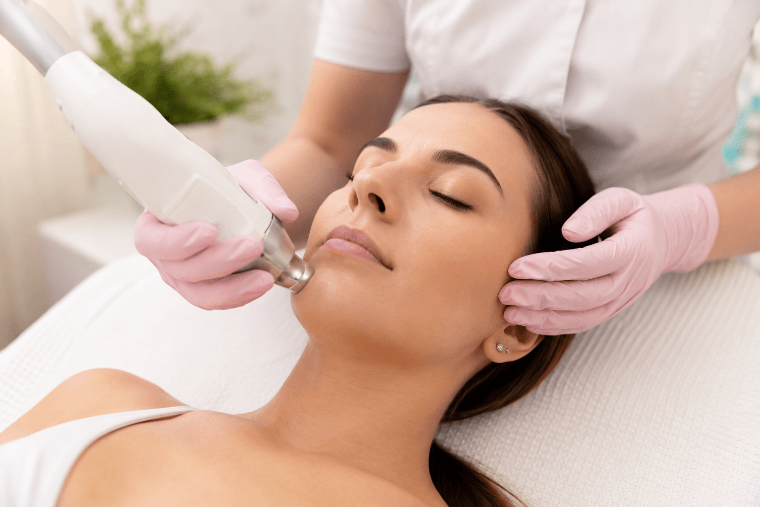 Woman receiving professional facial hair removal treatment in Rockwall, Texas for chin and upper lip hair reduction
