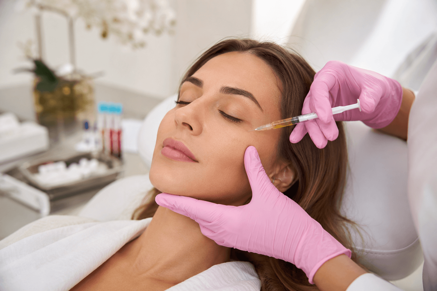 Patient receiving PRF platelet-rich fibrin facial injections during a personalized skin rejuvenation consultation in Rockwall, Texas