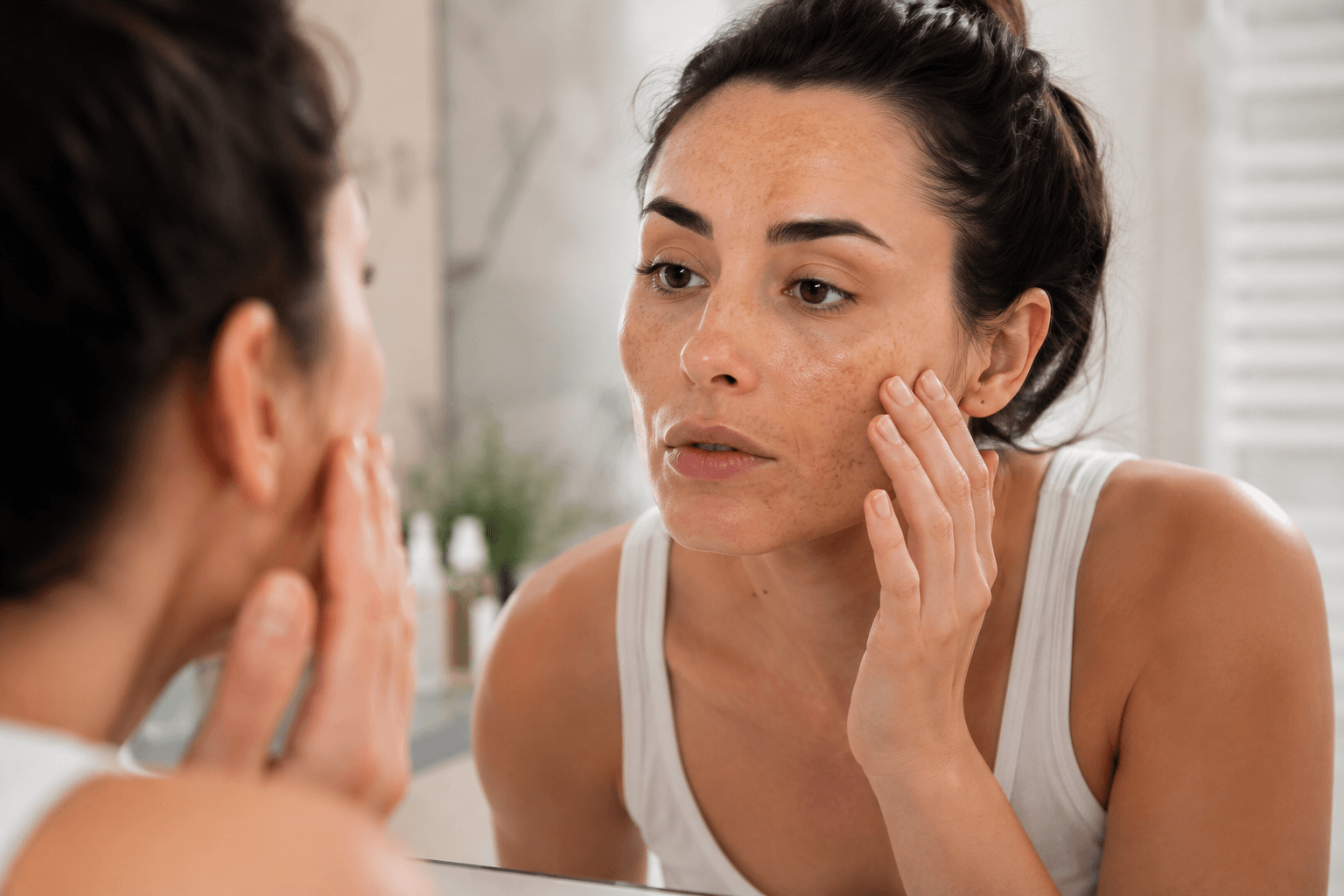 Esthetician performing a chemical peel treatment on a client's face at a Rockwall, TX medspa