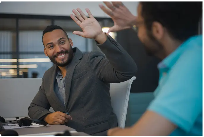 Man high fiving his partner
