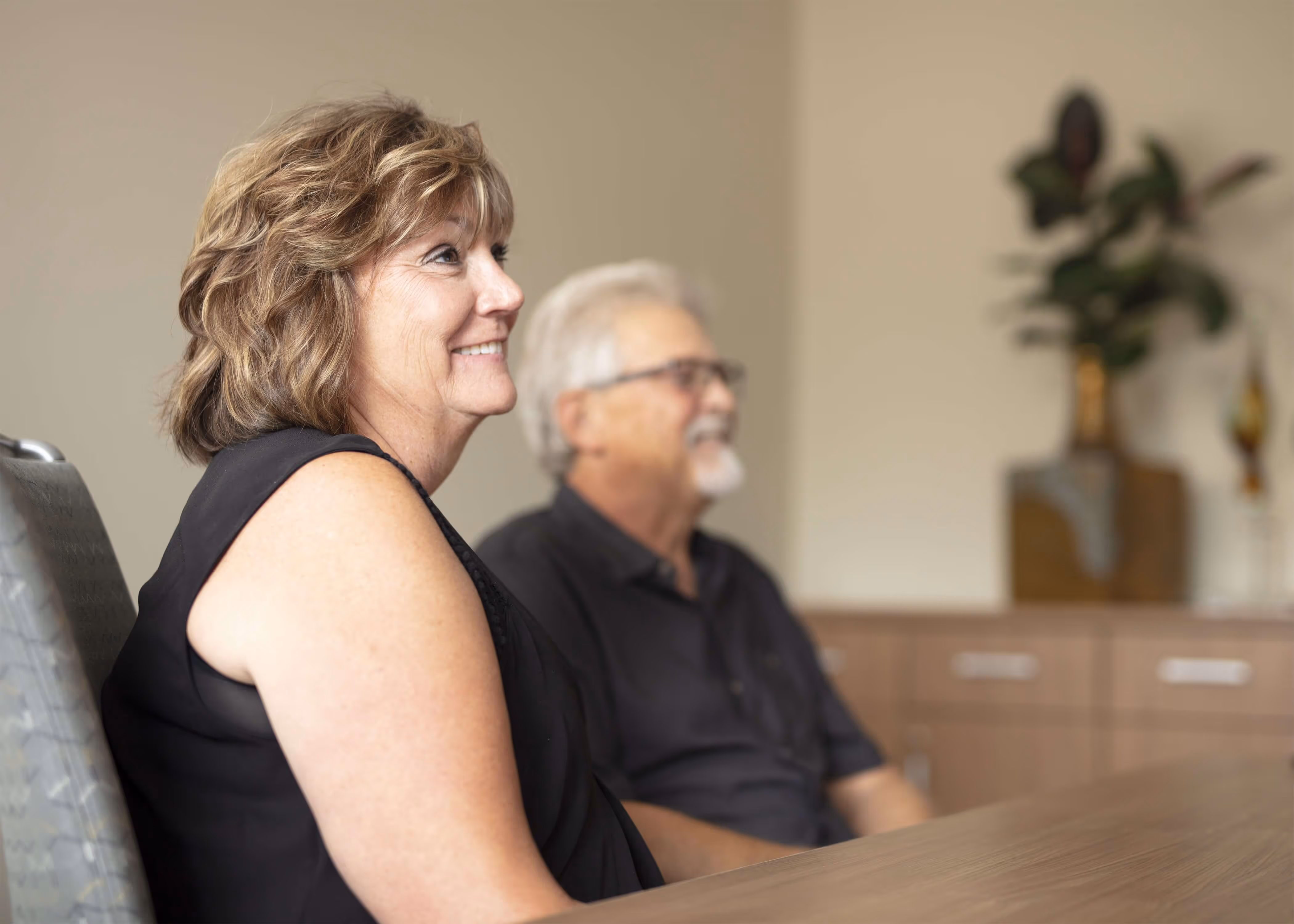 couple in a retirement tune up financial review meeting