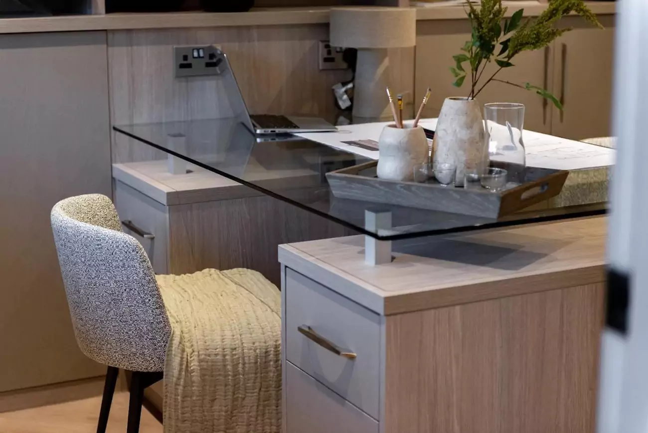 Wooden home office desk with glass table top