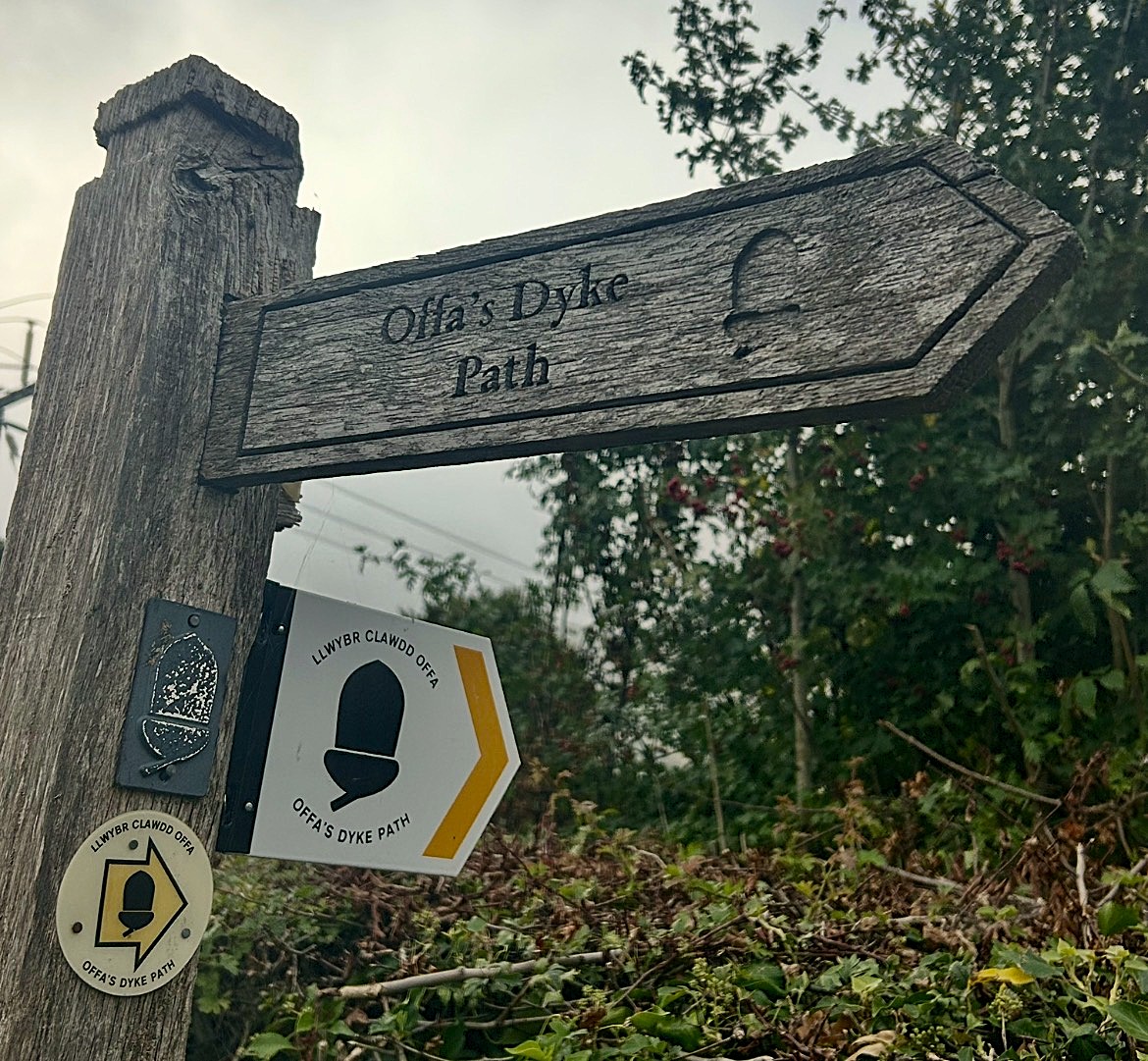 : National Trail signpost for Offa’s Dyke, one acorn symbol, three directional signs