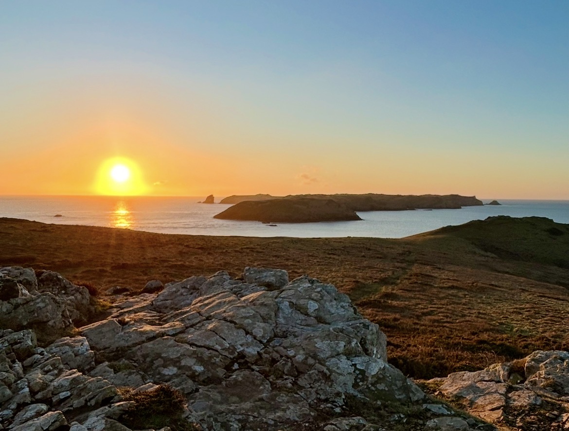 golden sunset over sea and distant island