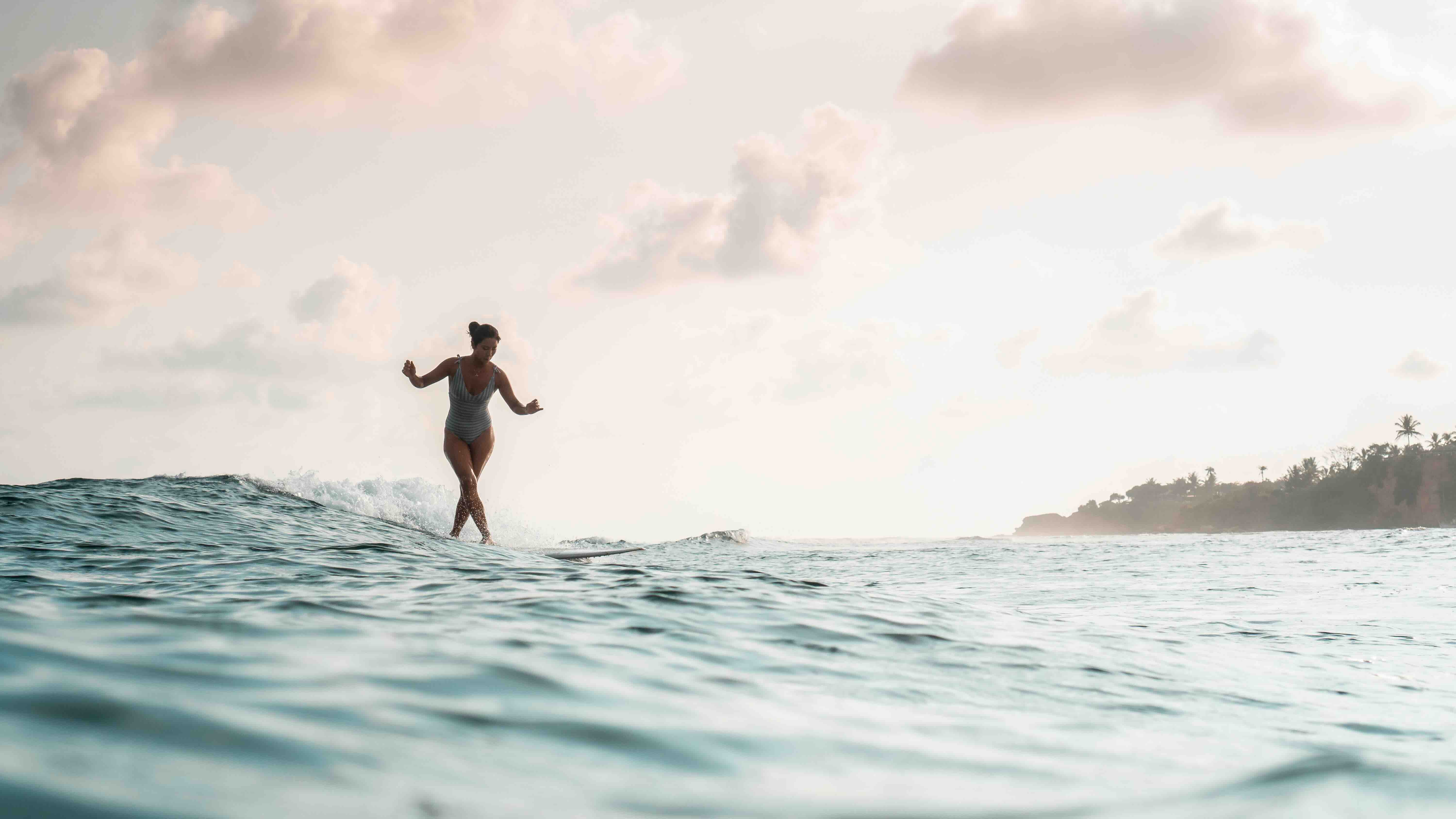 girl surfing cross step
