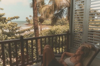 girl relaxing at the beach lodge with ocean view 