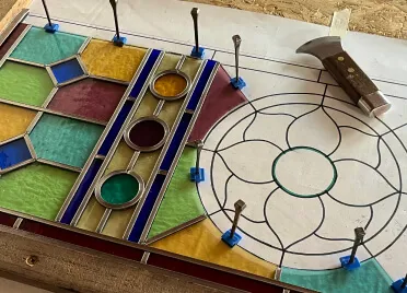 Traditional handcrafted stained glass panel in a front door, adding colour and character to a home