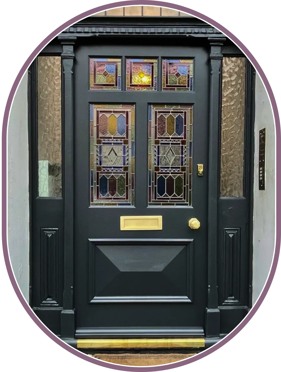 traditional victorian front door with stained glass