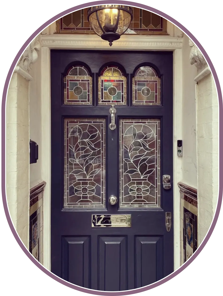 traditional victorian front door with stained glass