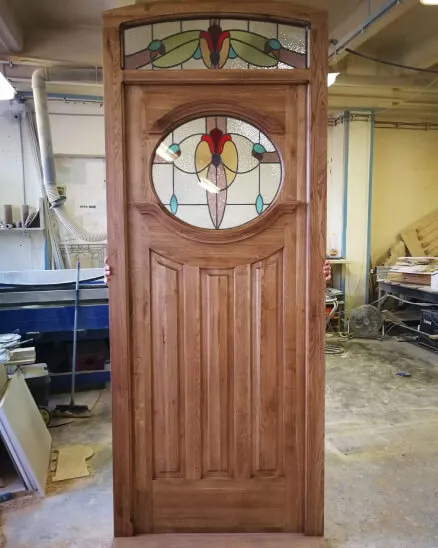 Oval 1930's stained glass front door with fanlight