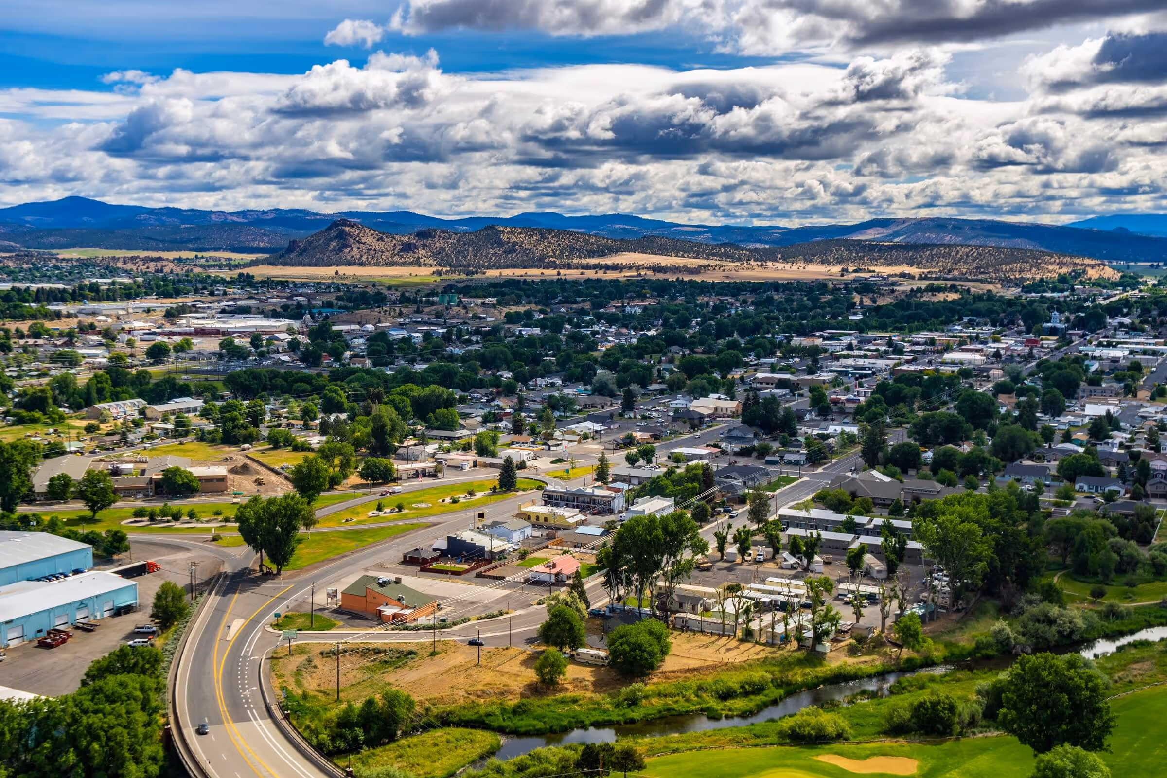 Aerial view of Prineville Oregon showing Crooked River Highway and surrounding ranchland, representing HealthCore Chiropractic & Rehab serving Prineville and Crook County patients from nearby Redmond