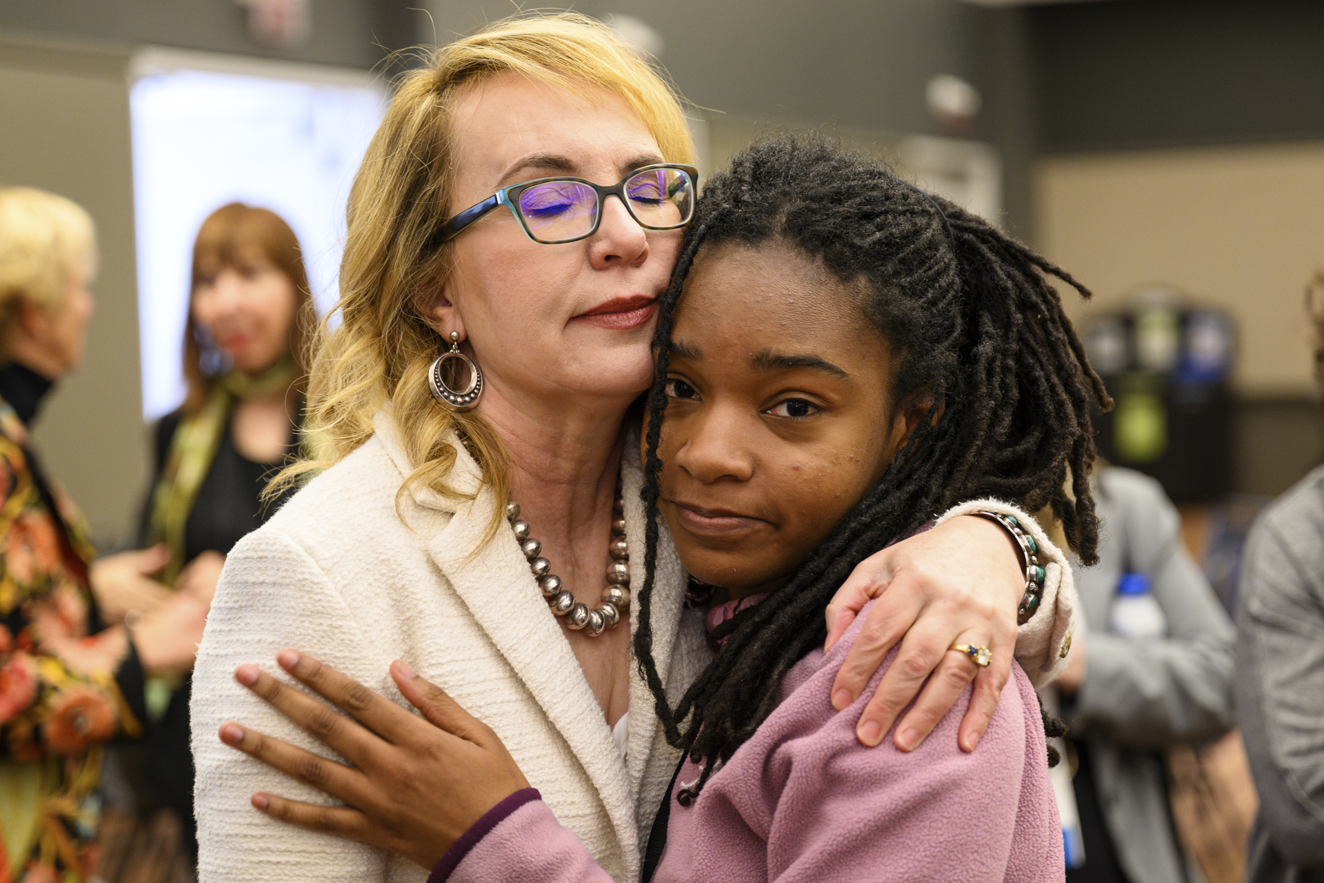 Gabby Giffords hugs a student at the Eradicate Hate Student Summit. 