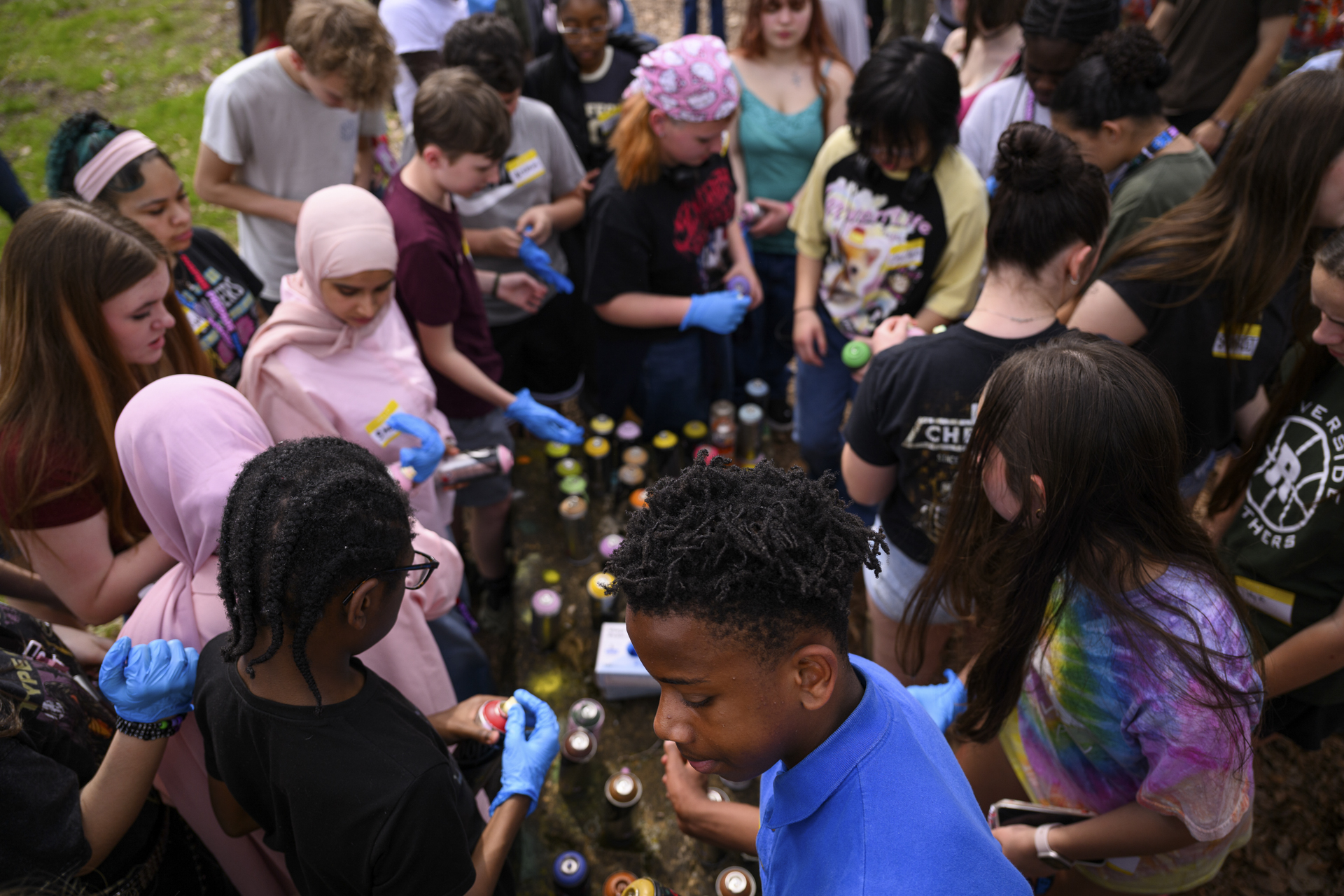 Students pickup cans of spraypaint to create art at the Rivers of Steel Carrie Blast Furnace.