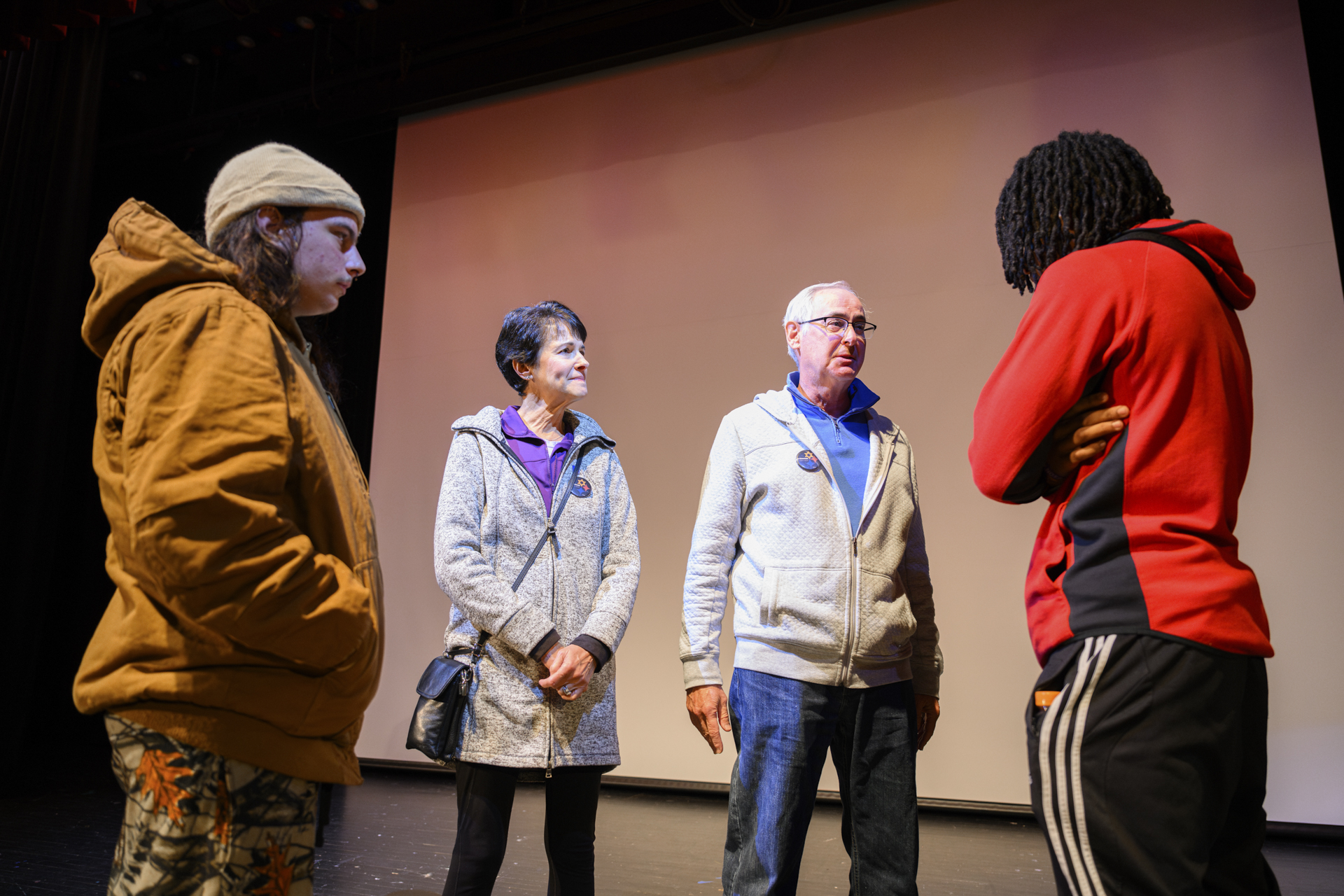 Students speaks with two 10.27 REACH Speakers.