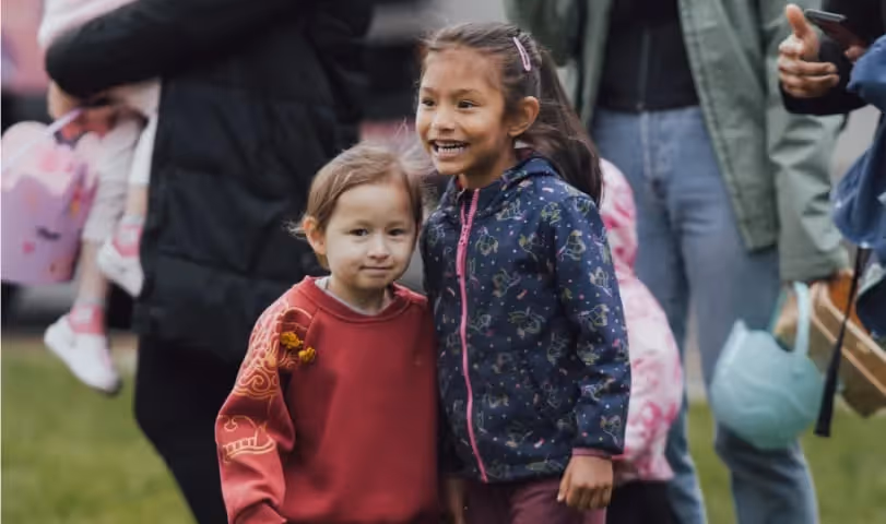 Two young children standing together