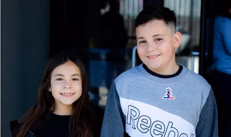 Two children smiling