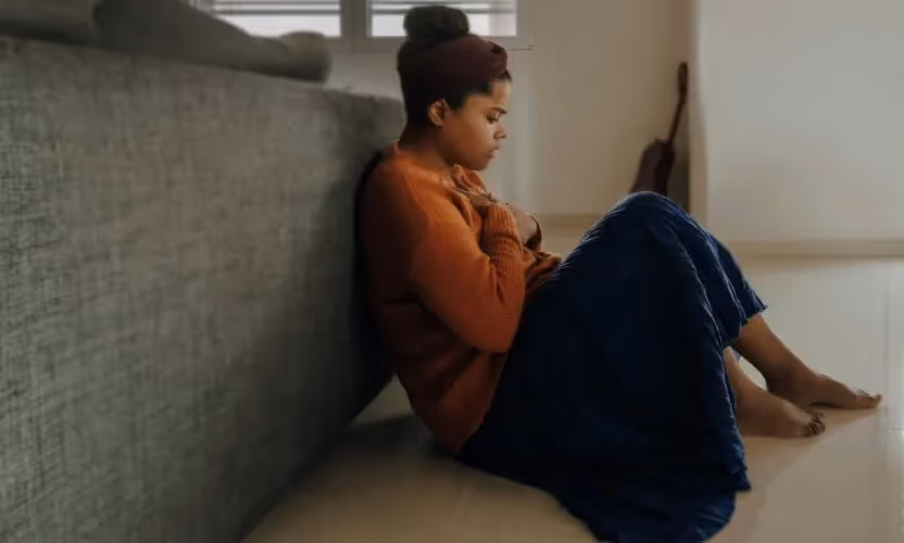 A woman sitting on the floor