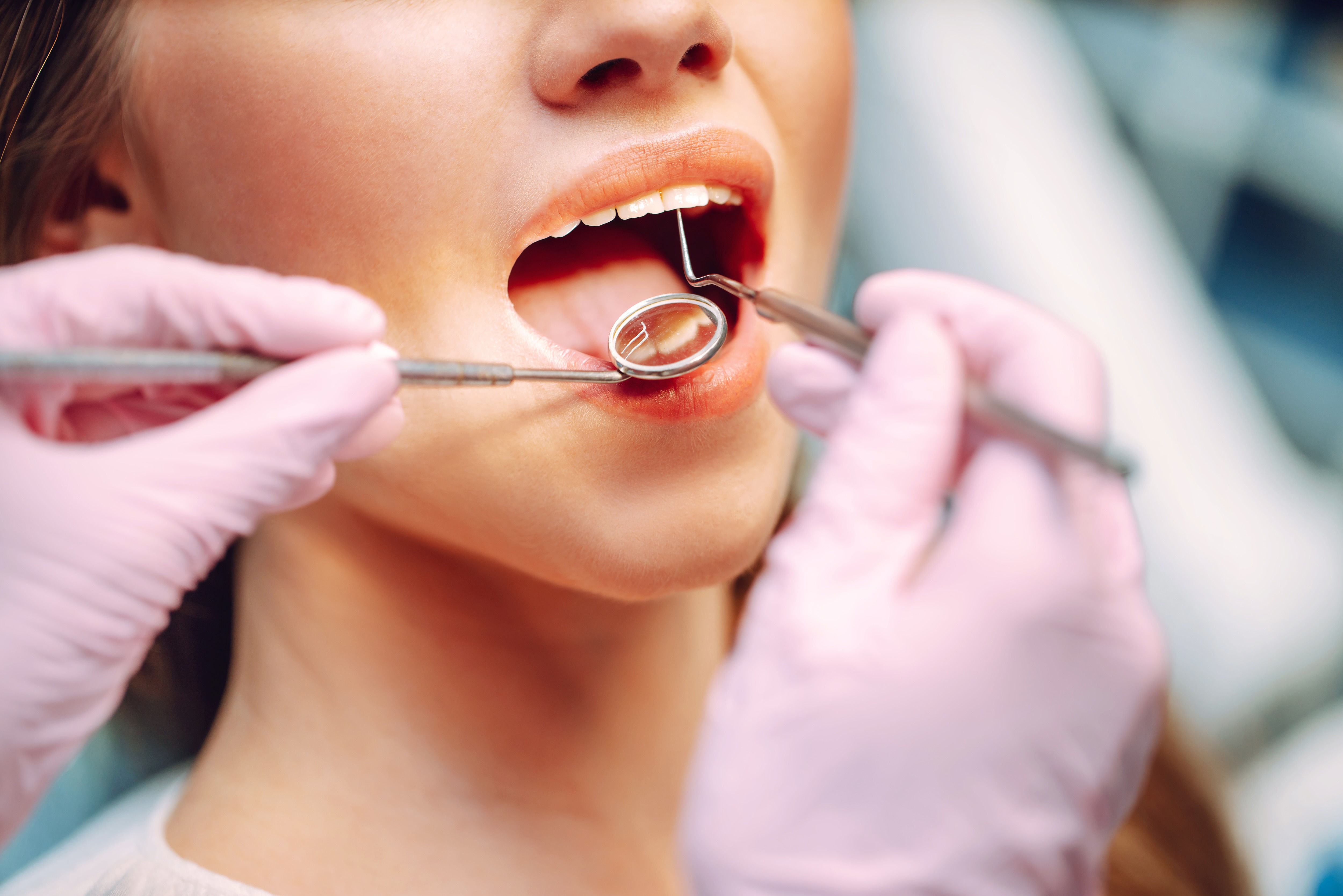 a woman getting her teeth cleaned