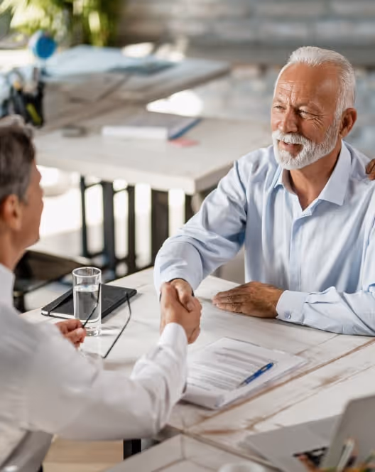 an old man shaking hand with a men