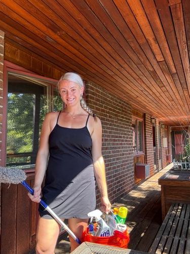 savannah holding a bucket to clean