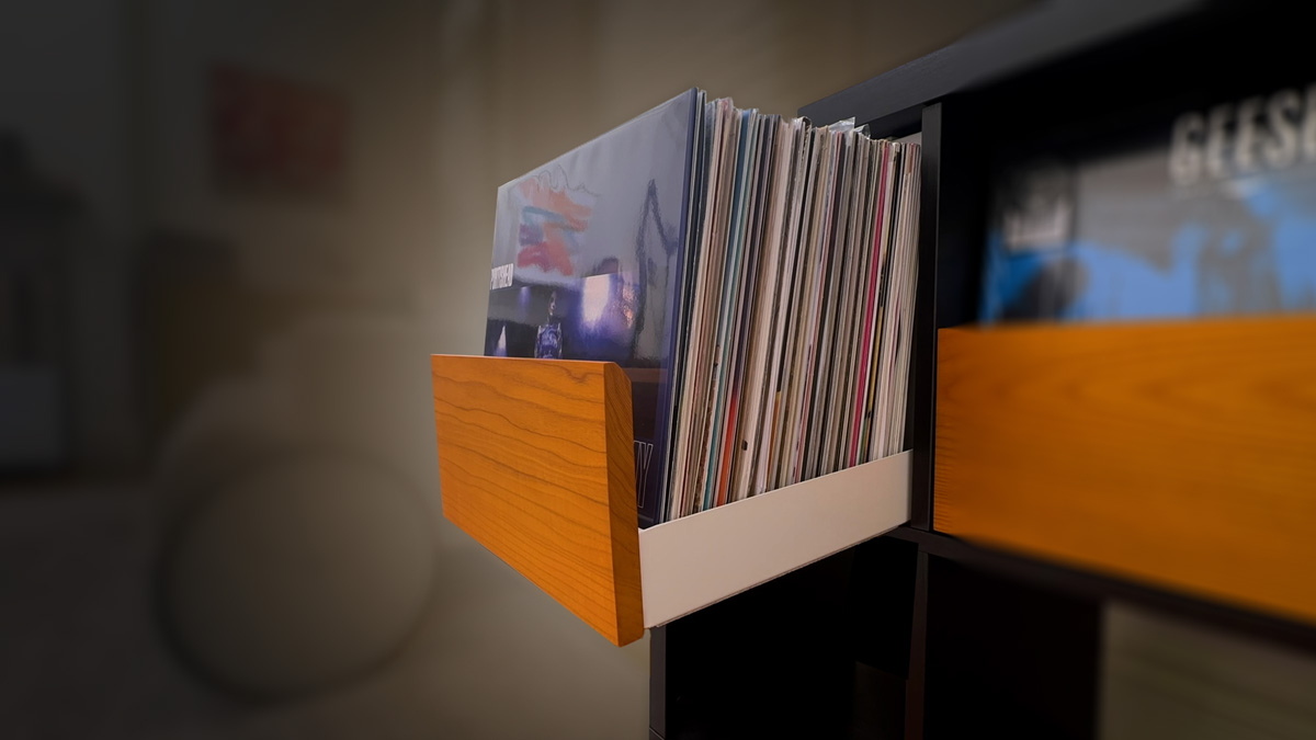 Open Warm Ash Klaxxon vinyl record drawer in a black IKEA Kallax, filled with records displayed front-facing