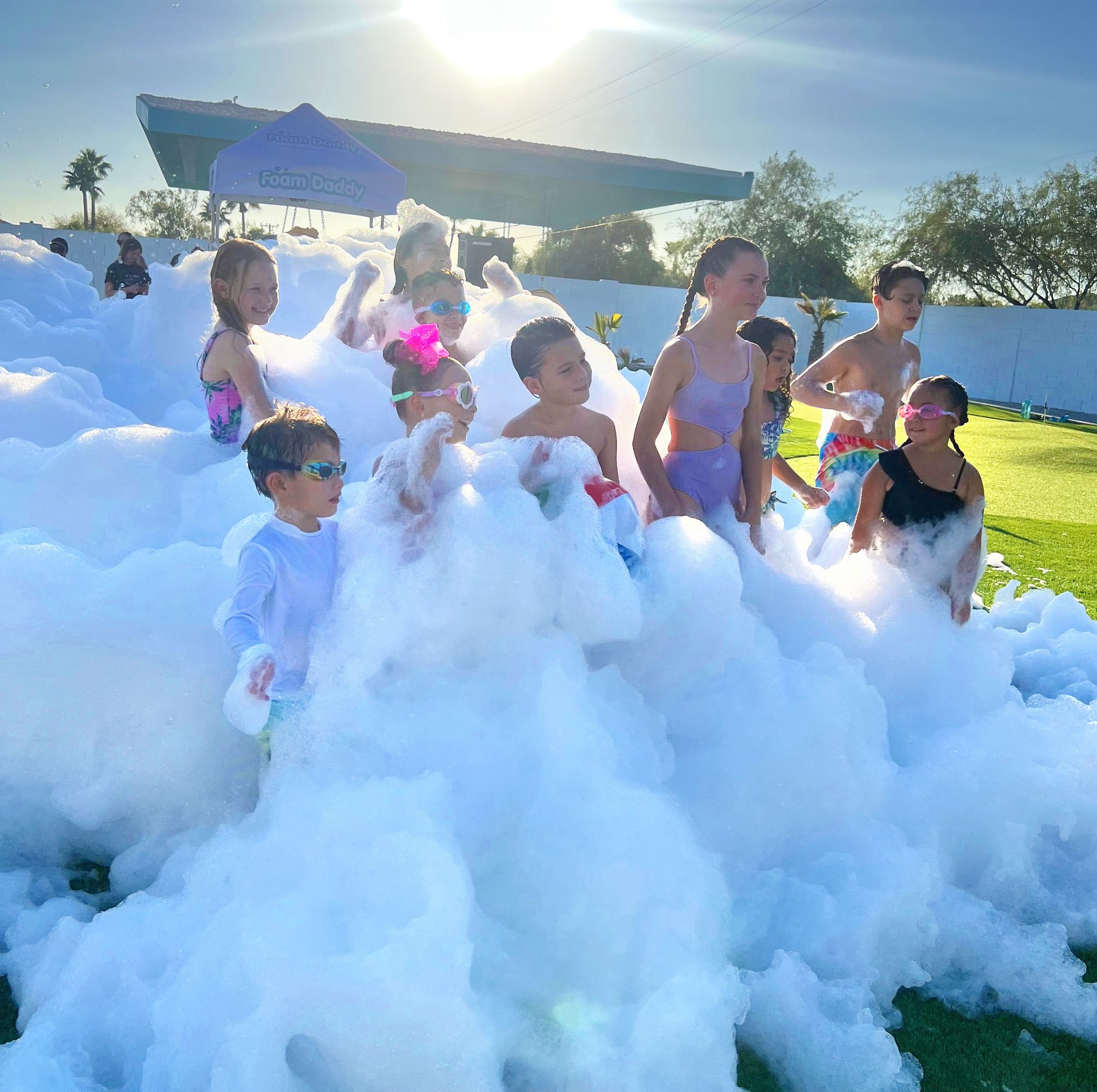 A crowd celebrating in foam at a Fairytale Foam Frenzy event