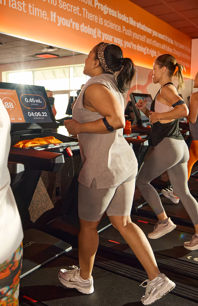 Woman running in a treadmill in Orangetheory Fitness class