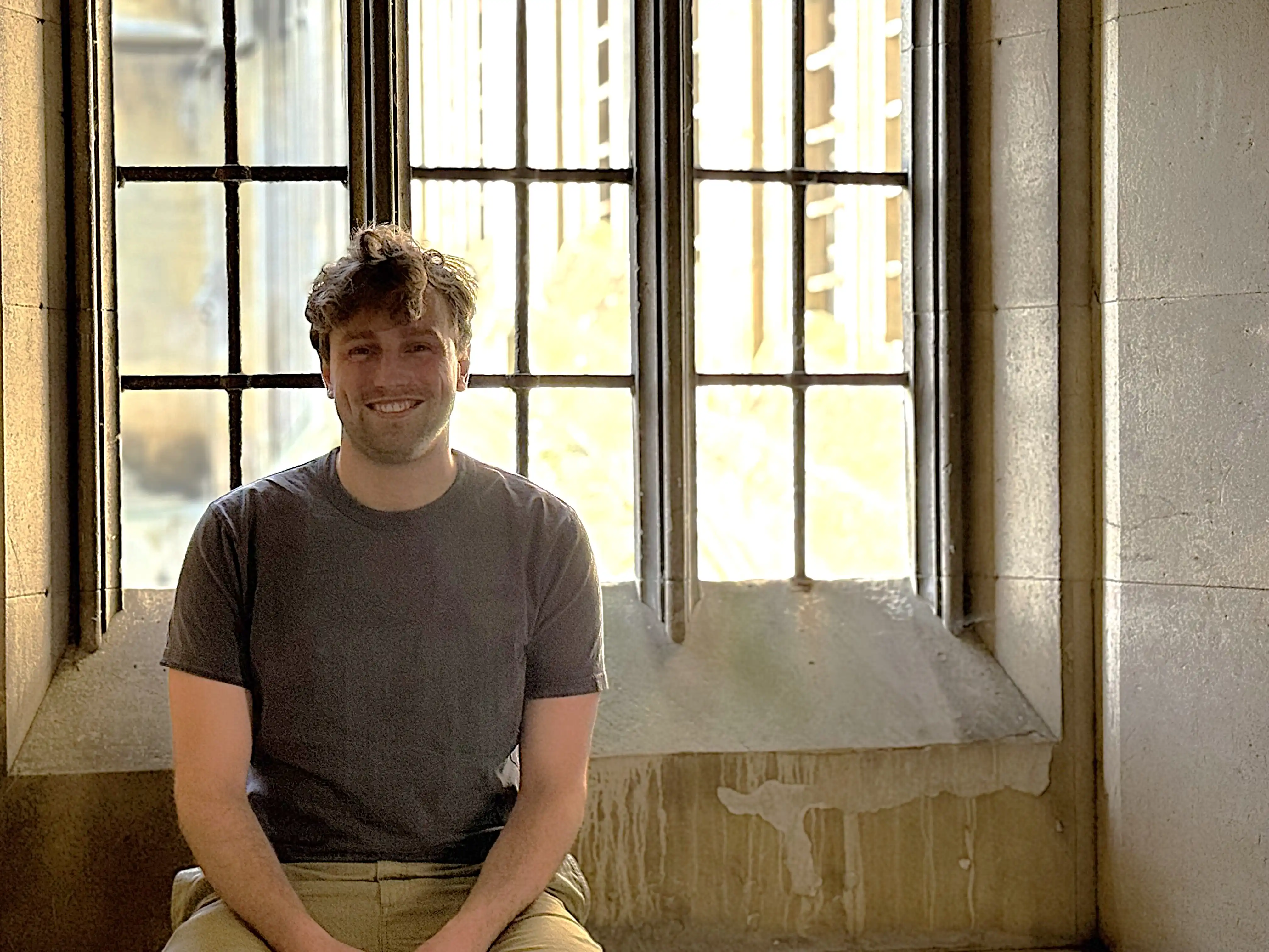 Charlie Colenutt at St John's College, with the Bridge of Sighs in the background