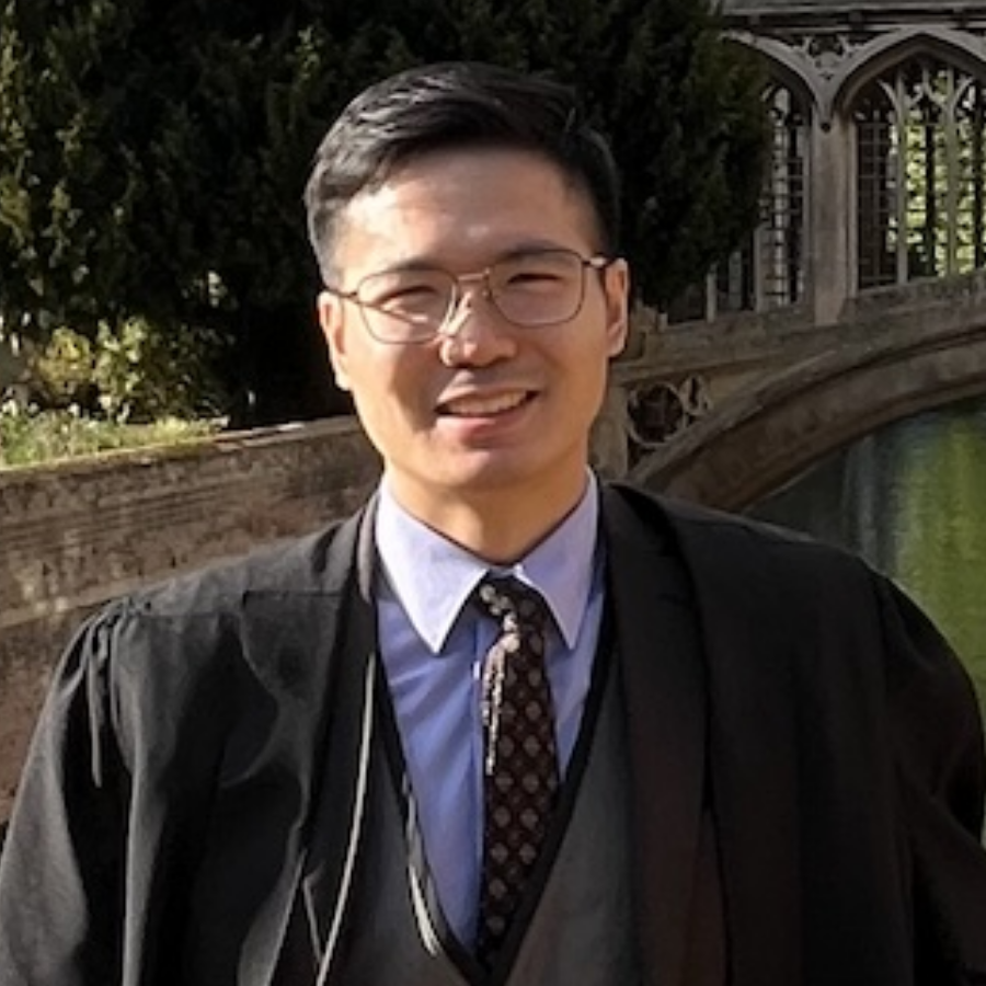 Dr Adrian Ka-Wai Chung stands on kitchen bridge looking at the camera