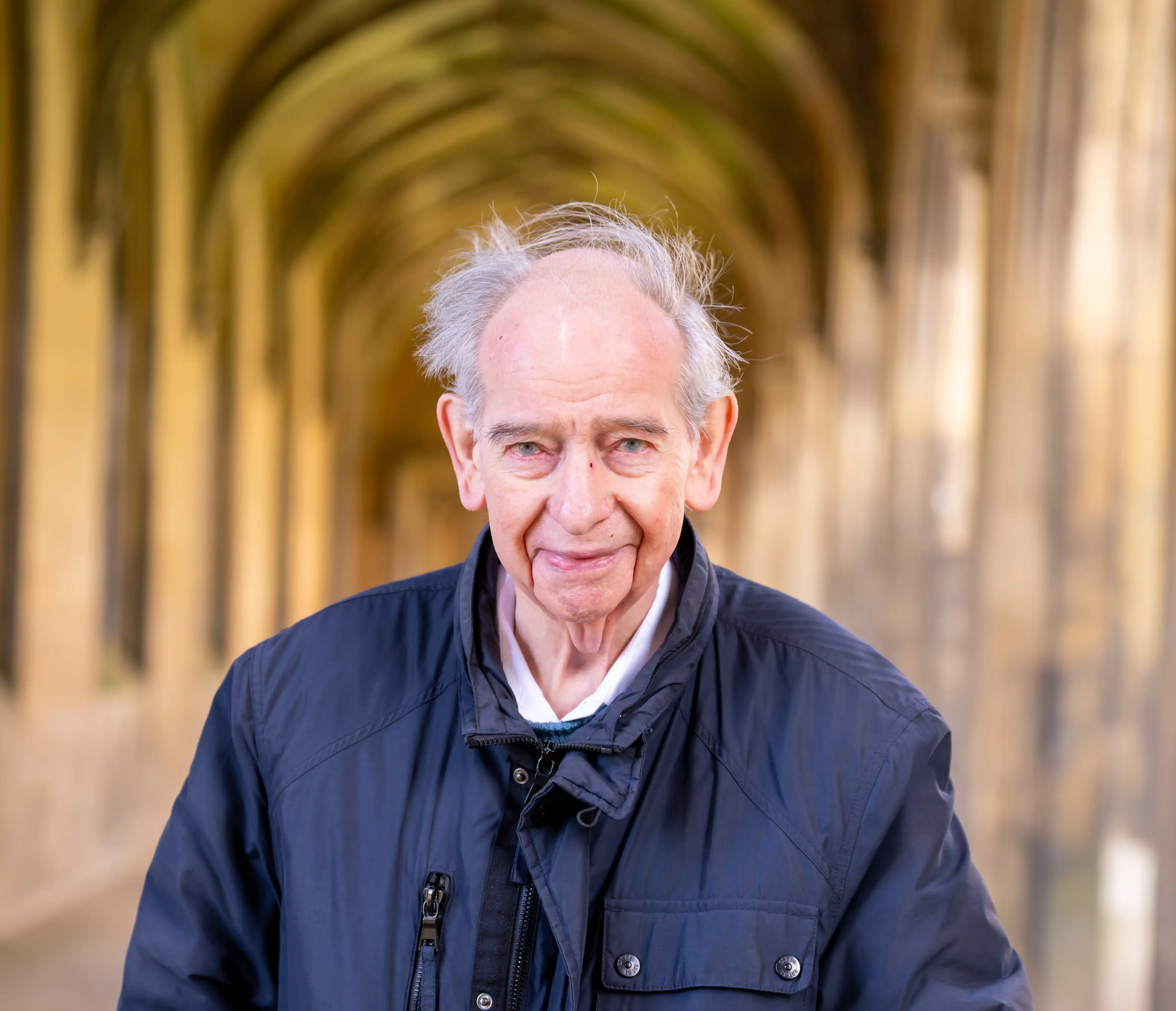 Professor John Iliffe in the Cloisters at St Johns College, Cambridge