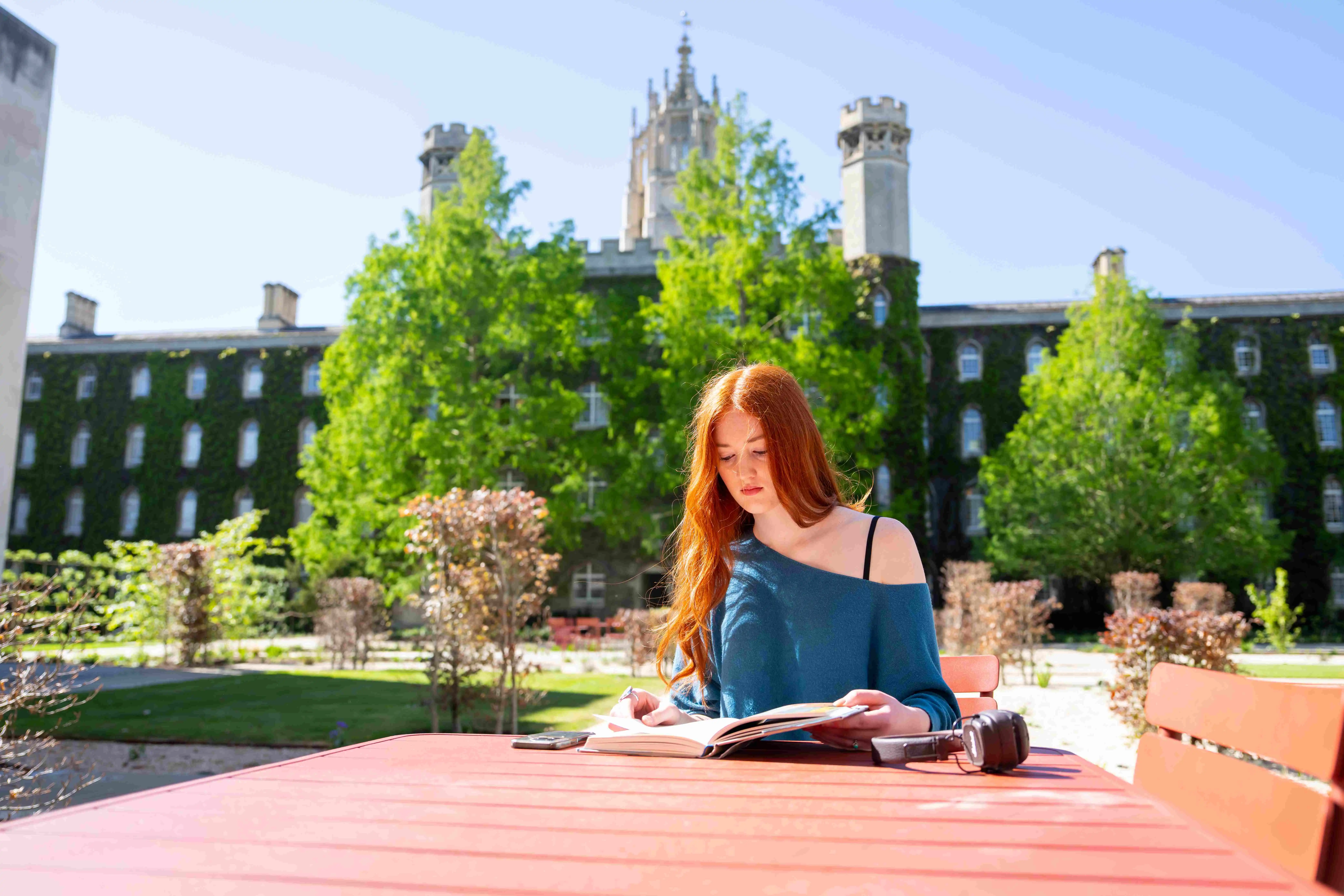 A student studying outdoors