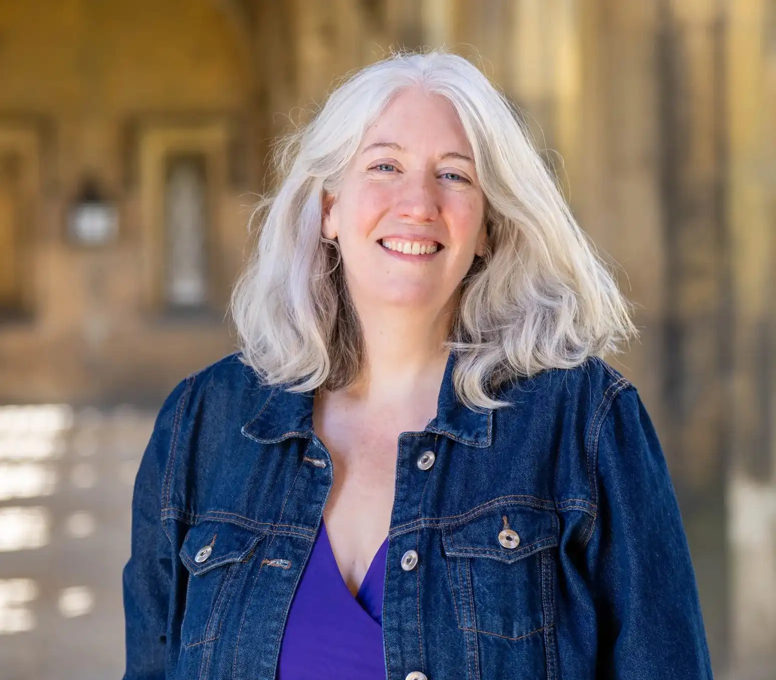 A portrait photo of Professor Josephine Crawley Quinn in the New Court Cloisters of St John's College