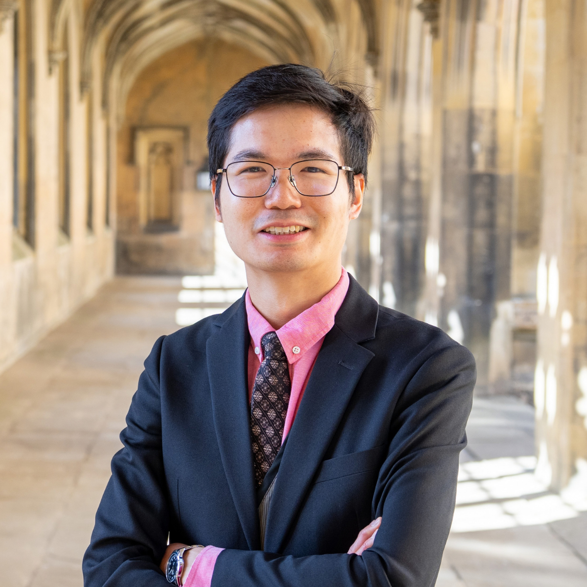 Dr Adrian Ka-Wai Chung stands on kitchen bridge looking at the camera