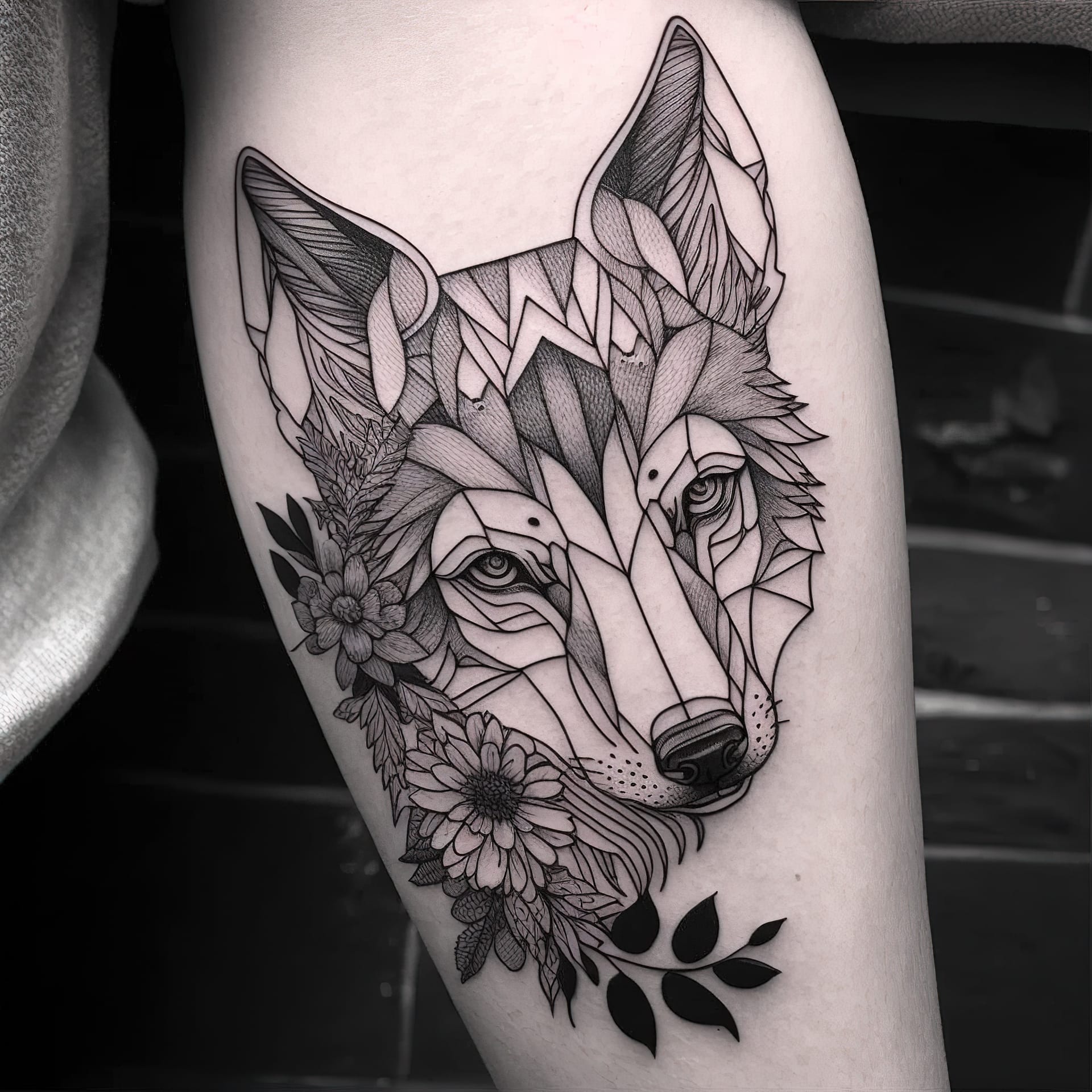 Tattoo design featuring geometric wolf with floral elements, showcasing Midjourney prompt engineering techniques and artistic influences.
