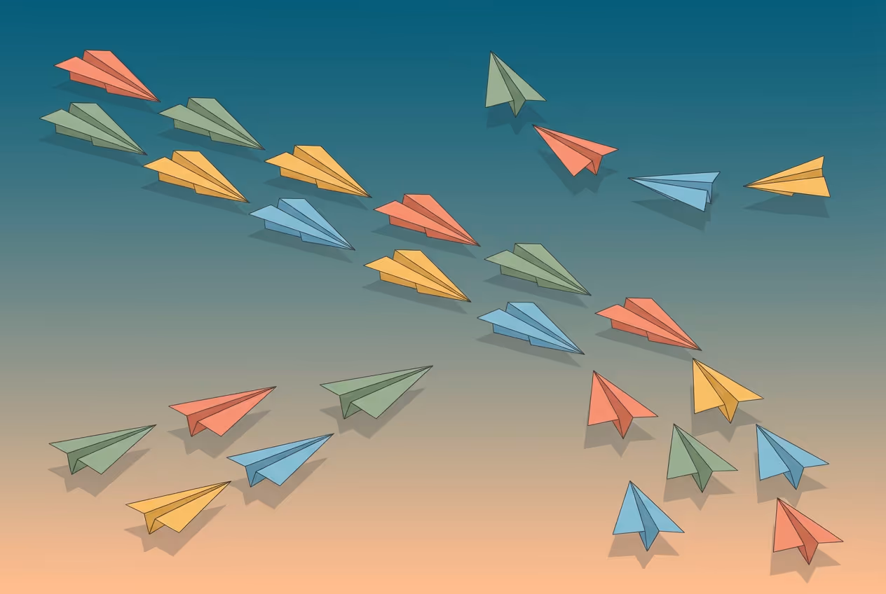 Colorful paper airplanes flying in