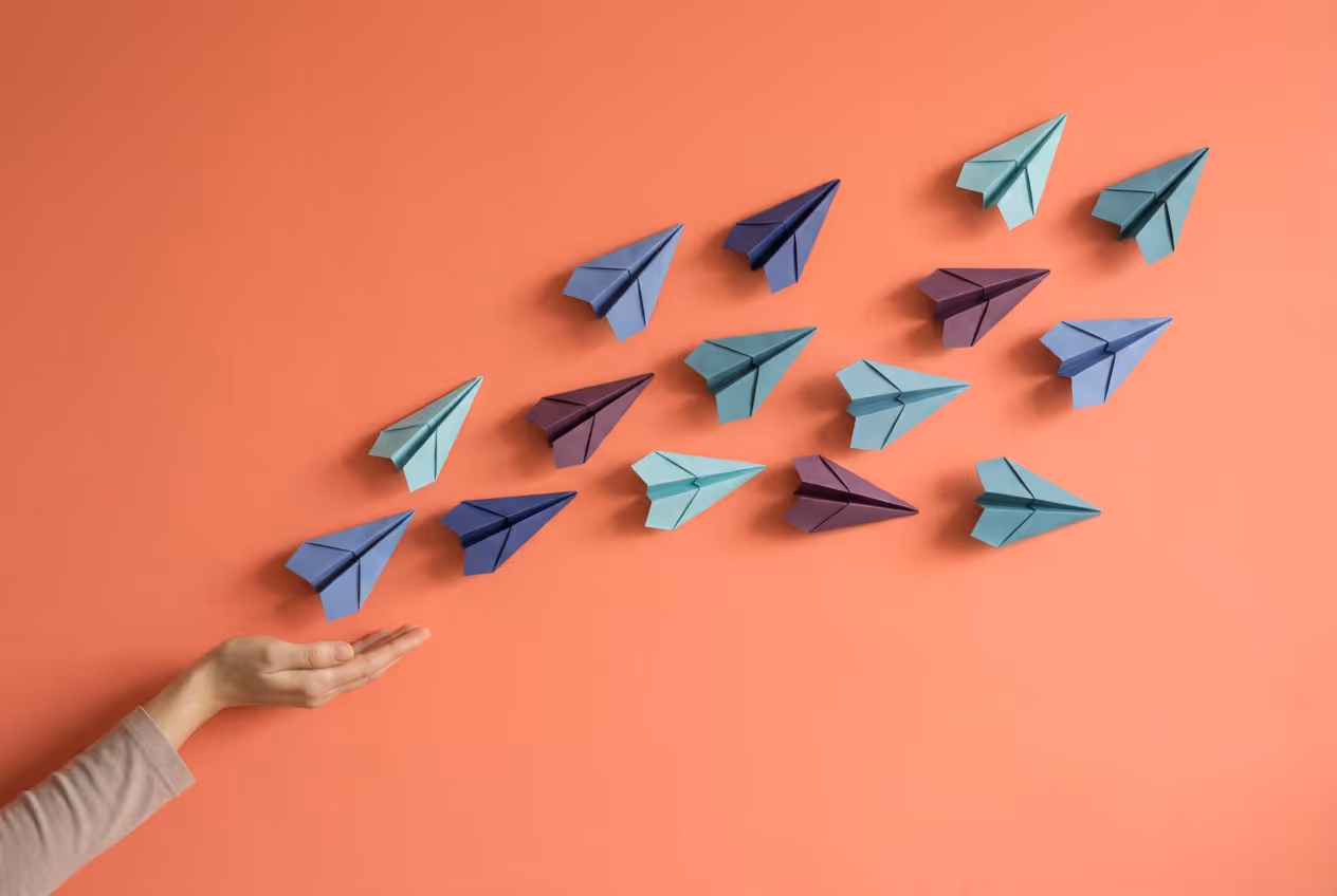 A hand releasing a flock