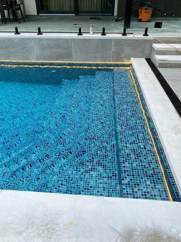 Overhead view of premium tile finish on concrete pool at Wildwood Drive Oakville